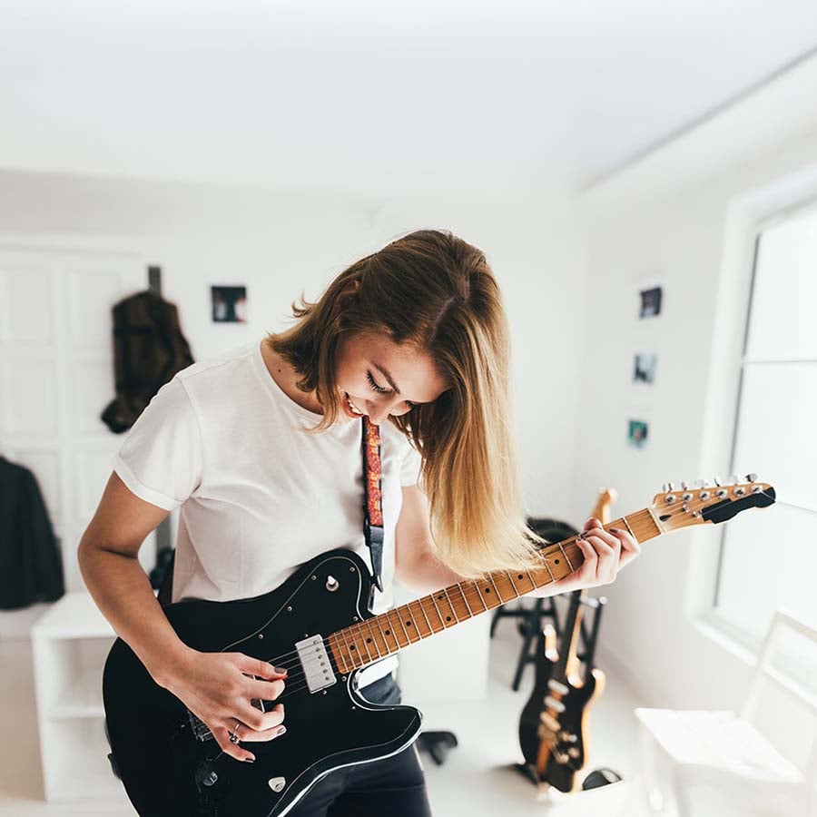 A person playing the guitar